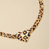 Leopard Heart Chain Necklace featuring a gold-plated chain and a leopard print heart pendant, perfect for femme bijoux.