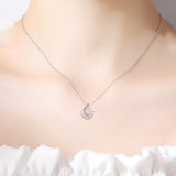 Star and Moon Pendant Necklace on a model's neck, showcasing the elegant 925 sterling silver design.