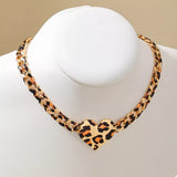 Leopard Heart Chain Necklace featuring black and gold hues on a chain, perfect bijou for femme style.