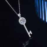 1 Carat 925 Sterling Silver Moissanite Key Pendant Necklace showcased on a black background, elegant and sparkling.