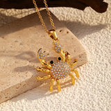 18K Gold-Plated Crab Pendant Necklace with rhinestones, stylish bijoux for femme on a textured surface.