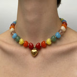 Colorful Heart Pendant Beaded Collarbone Necklace featuring a vibrant array of beads and a gold heart charm.